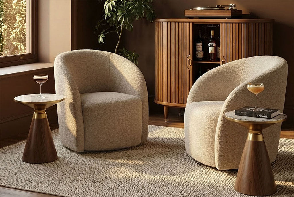Two Coddle Bromley Swivel Chair with small wooden tables in a room with a wooden cabinet and plant