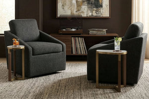 Two Huxley Swivel Chair in a living room setting with side tables and a television