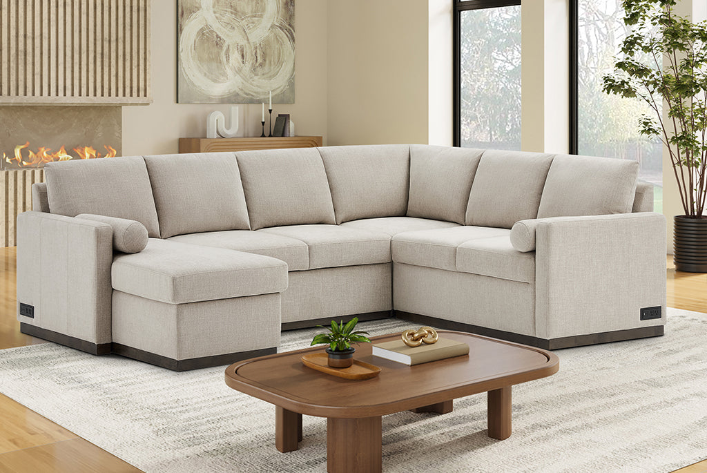 Beige Element Full-Size Sleeper Sectional with Storage Chaise in a living room with a wooden coffee table and decorative items