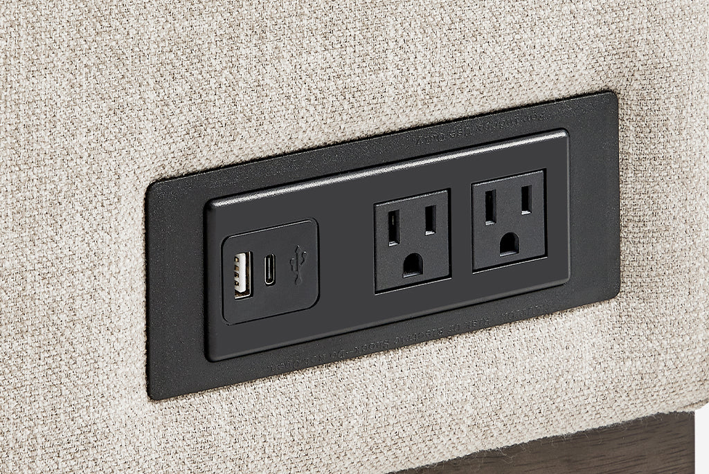 Black electrical outlet with USB port on a Coddle Element Full-Size Sleeper Sectional