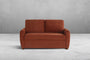 Rust colored Coddle sofa against a gray wall