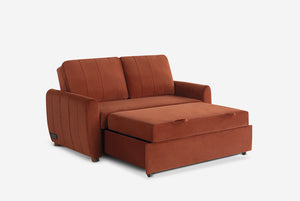 Rust colored Coddle sofa bed on a white background