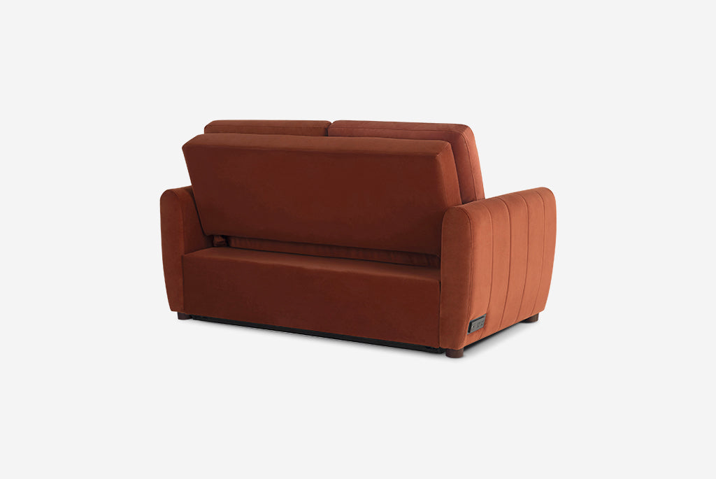 Rust colored Coddle sofa on a white background