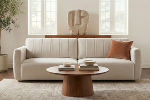 Beige Galaxy Queen Sleeper Sofa in a living room with a wooden coffee table and decorative items