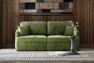 Green Matrix Queen-Sized Sleeper Sofa in a living room setting with a wooden wall and decorative elements