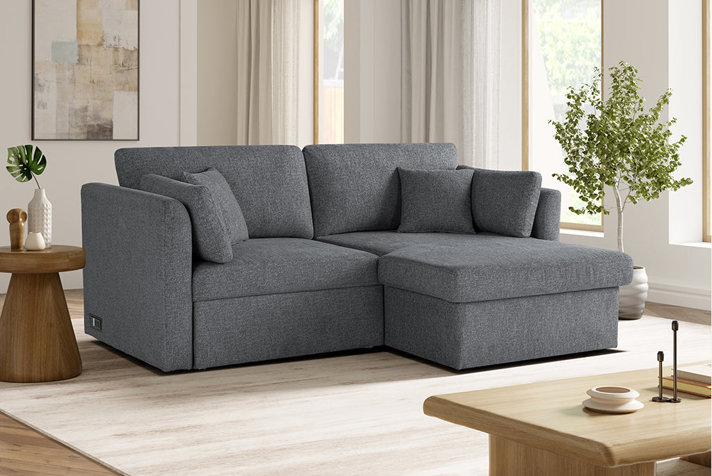 Gray Coddle sectional sofa in a living room setting with decor elements