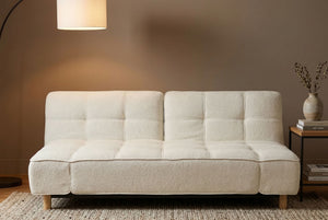 Fold Low Profile Convertible Couch in a room with a lamp and small table